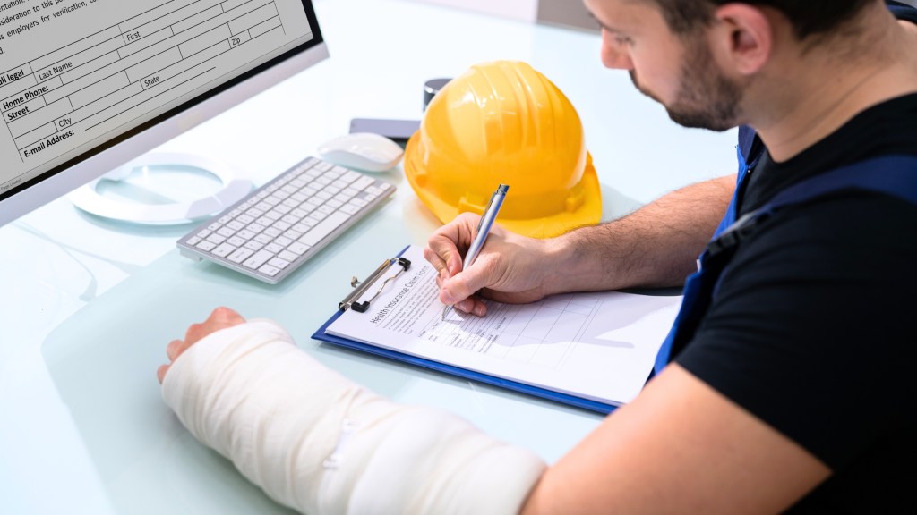 Man completing disability insurance claim.